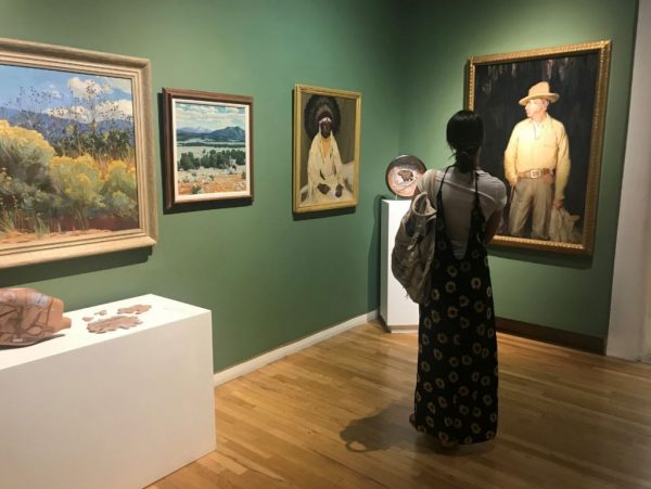 woman viewing art in harwood gallery