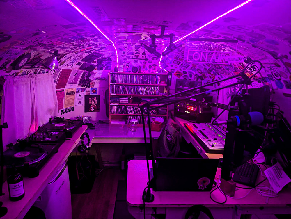 same-place-2 inside of a radio studio, audio equipment under pink light