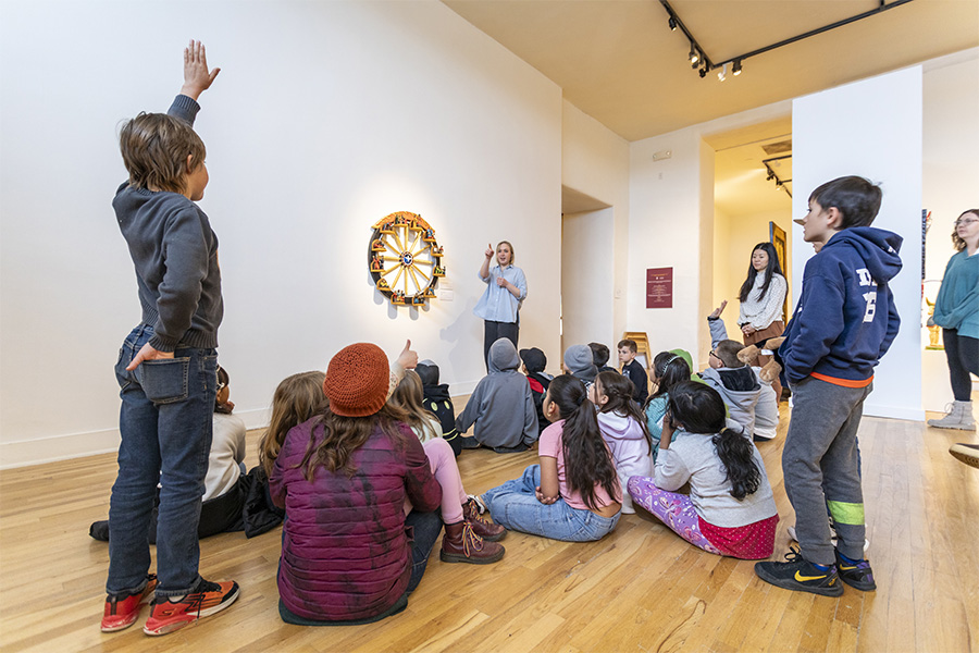 children gathered on a school tour in the gallery