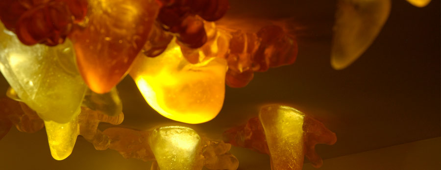 amorphous glass sculptures glow with incandescent light